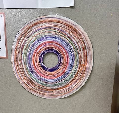 Photo of a colorful string art circle
